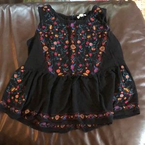 Gentle used tank with beautiful flower design.